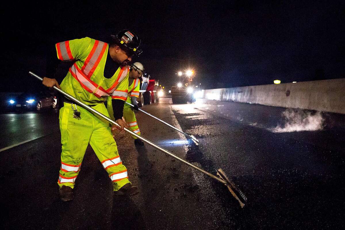 O.C. Jones and Sons contractors working with CalTrans pave rubberized hot-mix asphalt on two of the Southbound lanes of the I-880 freeway in Hayward, Calif. on Wednesday, Oct. 9, 2018.