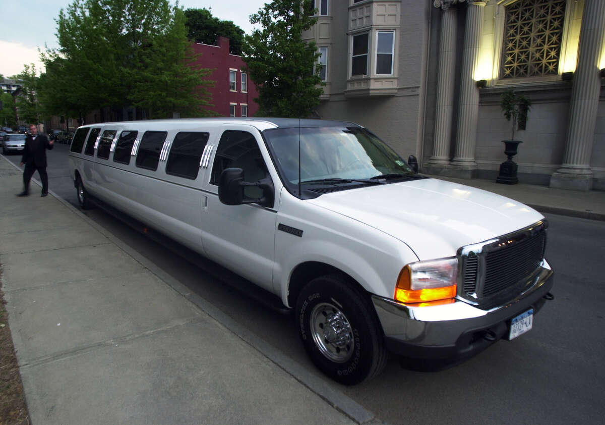 This Times Union photo, taken on May 11, 2001, shows the stretch limo that was later involved in the Oct. 6, 2018 crash in Schoharie County that killed 20 people, including the limo driver and all 17 passengers. At the time this photo was taken, the 34-foot long vehicle was owned by Larry Macera, of Royale Limousine Services of Rensselaer. The vehicle was sold in 2016 to Prestige Limousine of Wilton. This photo was part of coverage of the Maple Hill High School Prom at Franklin Plaza in Troy. (James Goolsby/Times Union)