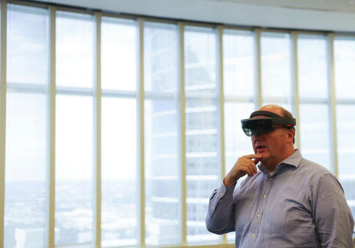 Ed Moore, who manages IIoT (Industrial Internet of Things) technology for Chevron, demonstrates how the company is starting to use augmented reality technology through the Microsoft HoloLens, Monday, Oct. 1, 2018 in downtown Houston.