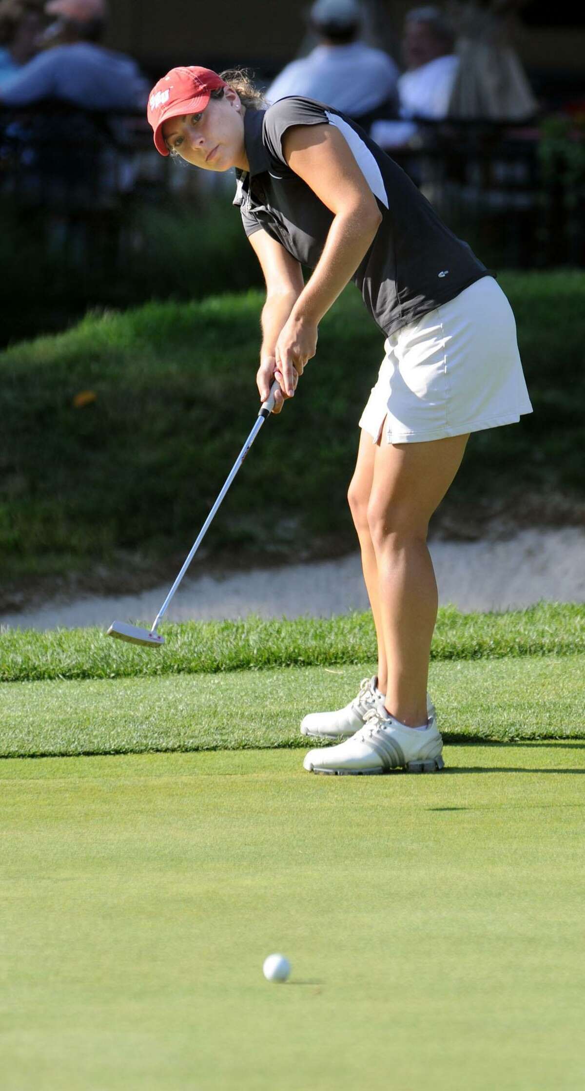 Jen Tierney putts on the 18th hole Sunday during the Danbury Amateur golf championship at Richter Park, July 18, 2010.