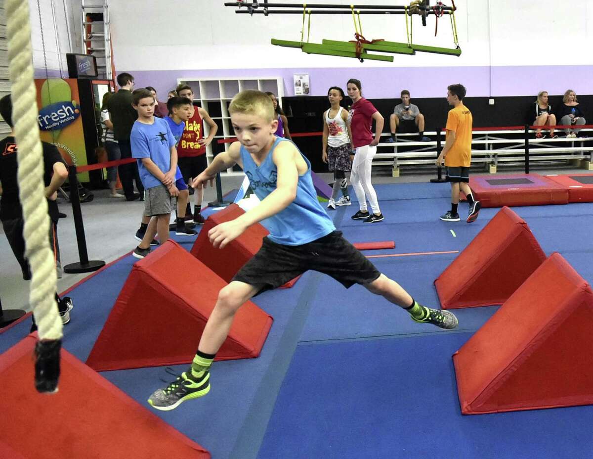 Sean Arms, 10, of Clinton, goes through his workout Wednesday at New Era Ninjas gym in Hamden.