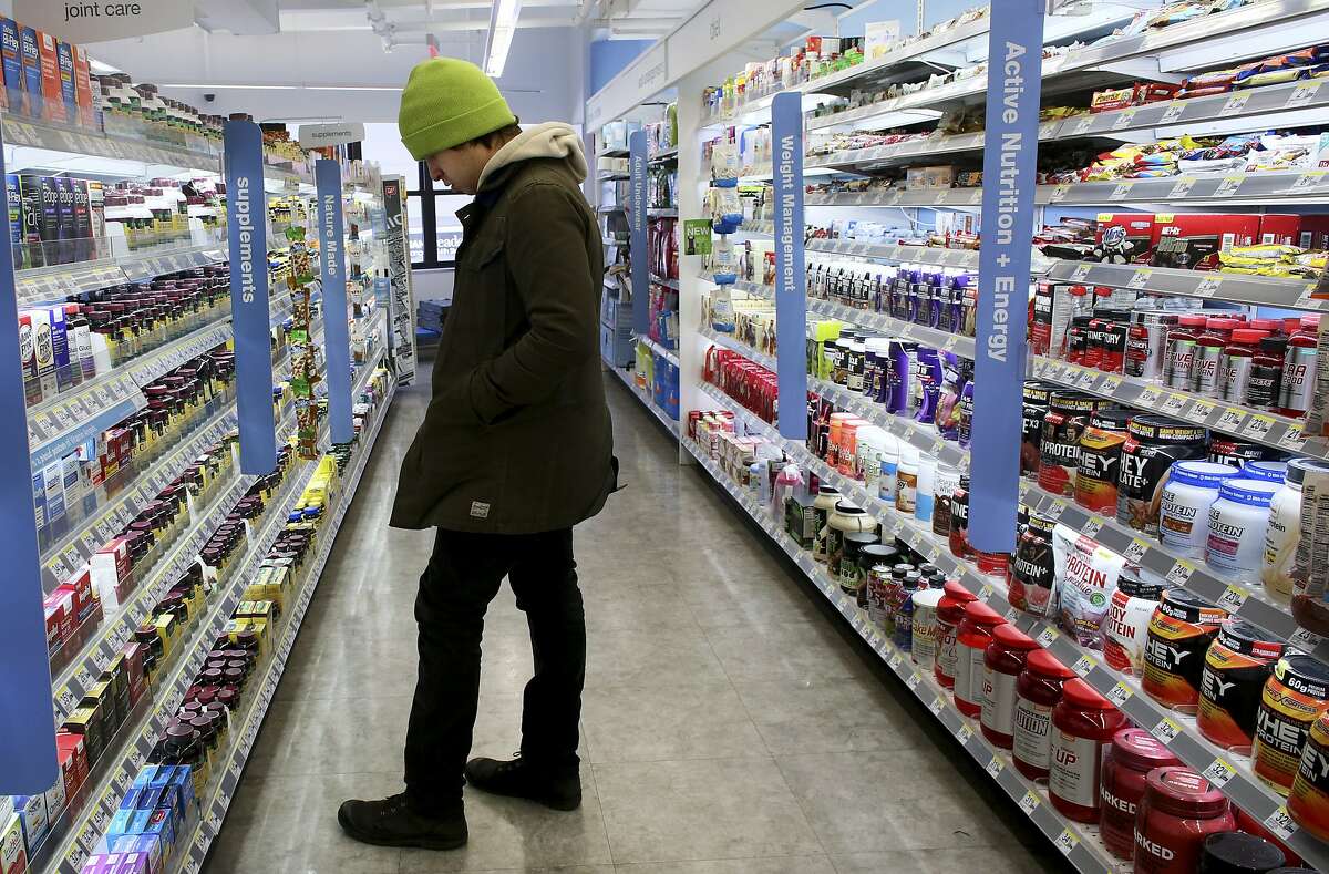 A shopper peruses pills at a Walgreens, one of three chains accused by New York State officials of selling fraudulent supplements, in New York, Jan. 28, 2015. GNC, the countryâ€™s largest specialty retailer of dietary supplements, has agreed to test the purity of its herbal products after accusations of selling supplements that were fraudulent or contaminated with unlisted ingredients that could pose health risks to consumers. (Yana Paskova/The New York Times)