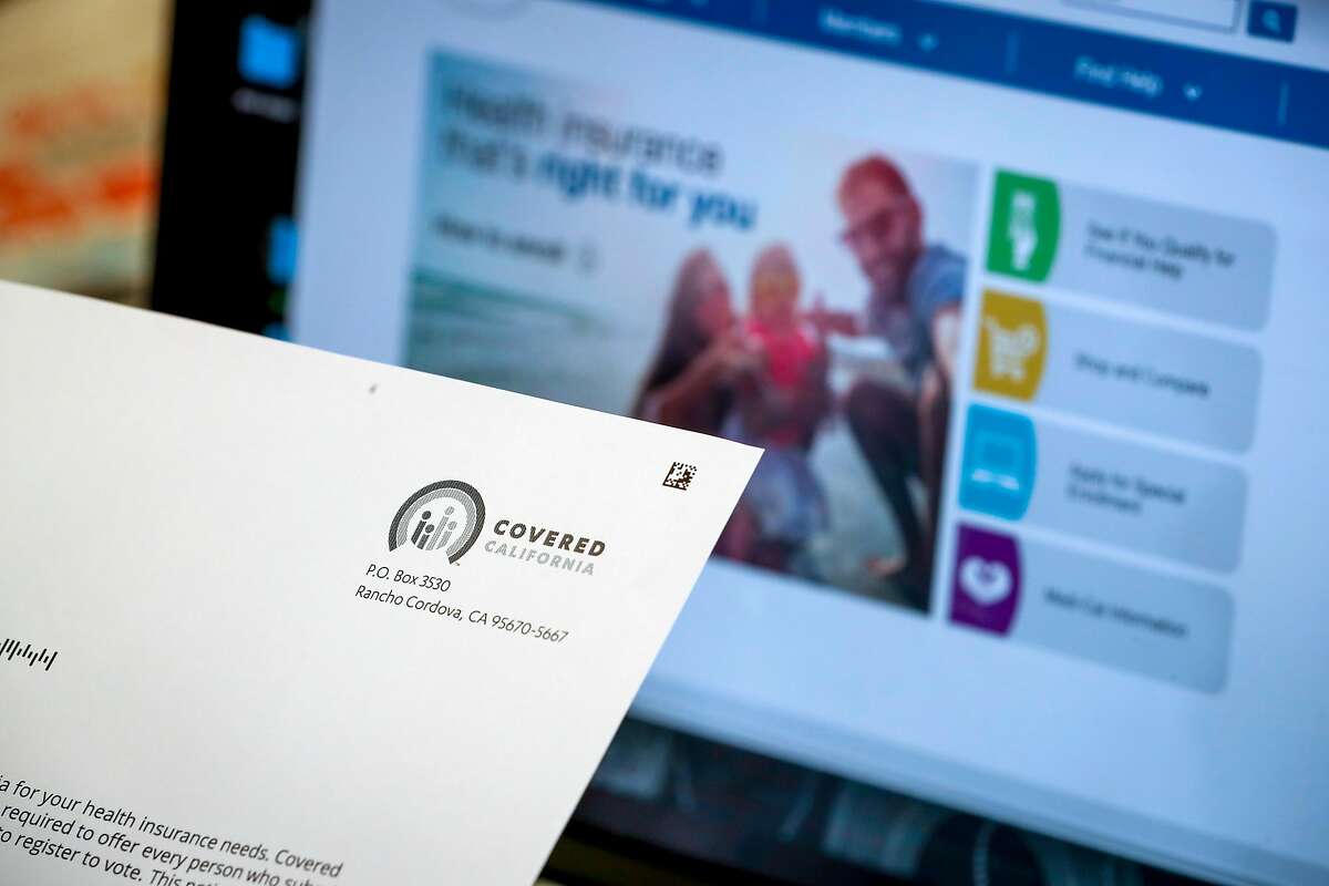 Tiffany Lin, a part-time teacher, opens a acceptance letter from Covered California at her parents home on Thursday, May 17, 2018, in Cupertino, California. A new UC study projects increasing numbers of Californians will lack health insurance in the years to come, thanks to the end of the federal individual mandate penalty.