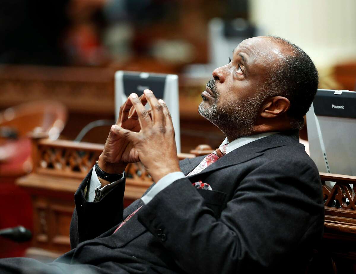 State Sen. Roderick Wright, D-Inglewood, takes a moment to look toward the ceiling on his first day in the Senate after last week's conviction for perjury, at the Capitol in Sacramento, Calif., Monday, Feb. 3, 2014. A Los Angeles County Superior Court jury found Wright guilty on eight counts of perjury and voter fraud. He faces up to eight years and four months in prison when he is sentenced on March 12. (AP Photo/Rich Pedroncelli)