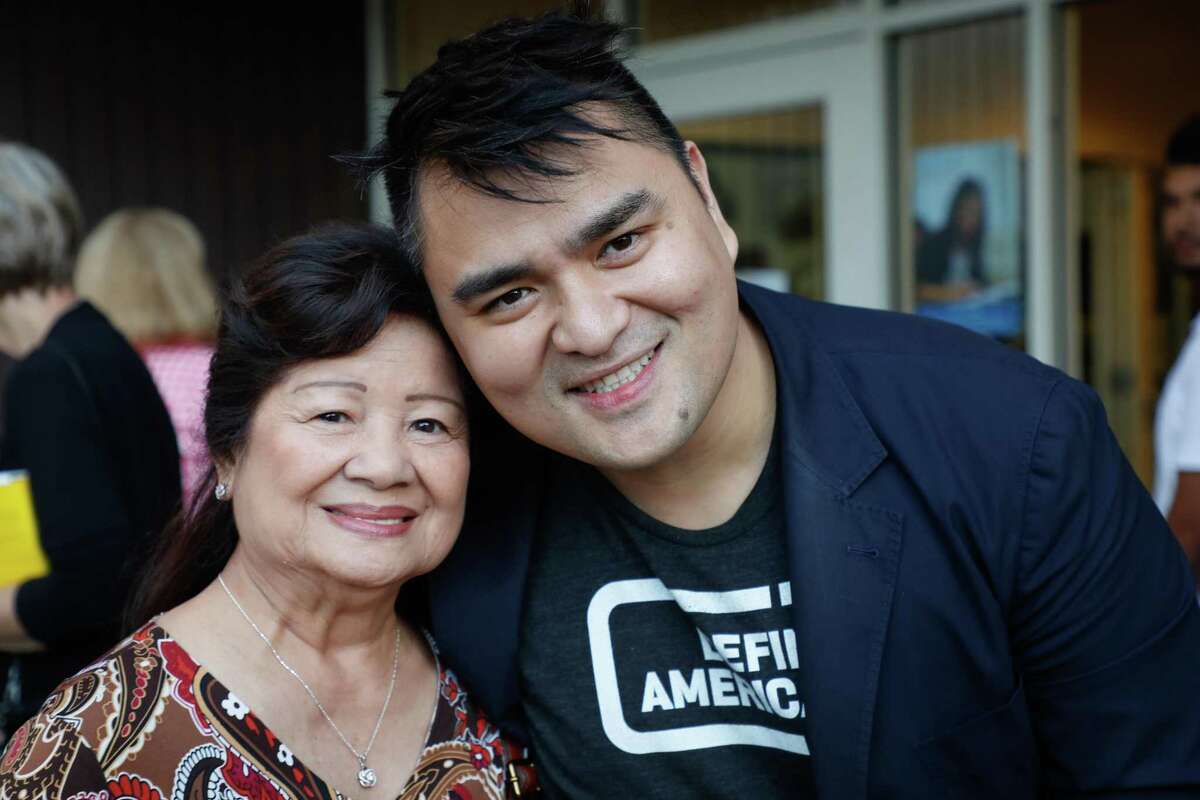 Pulitzer Prize-winning journalist and founder of Define American Jose Antonio Vargas poses for a portrait with his grandmother, Lola Florie, as he attends a private book-launch event for his new book “Dear America: Notes of an Undocumented Citizen” at Mountain View High School in Mountain View, Calif.