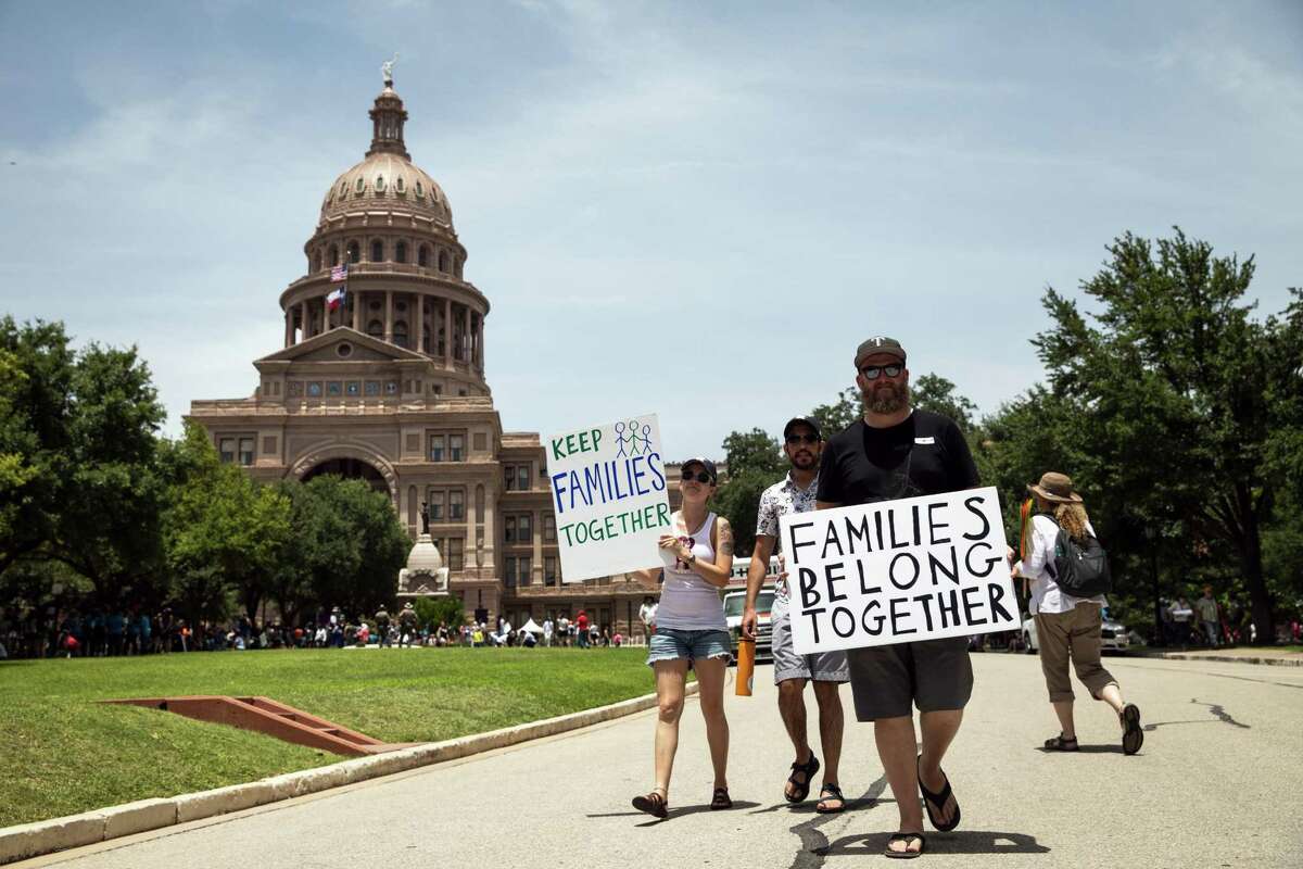 Demonstrators rally against the Trump administration’s immigration policies outside of the Texas Capitol in Austin, Texas, on June 30, 2018.