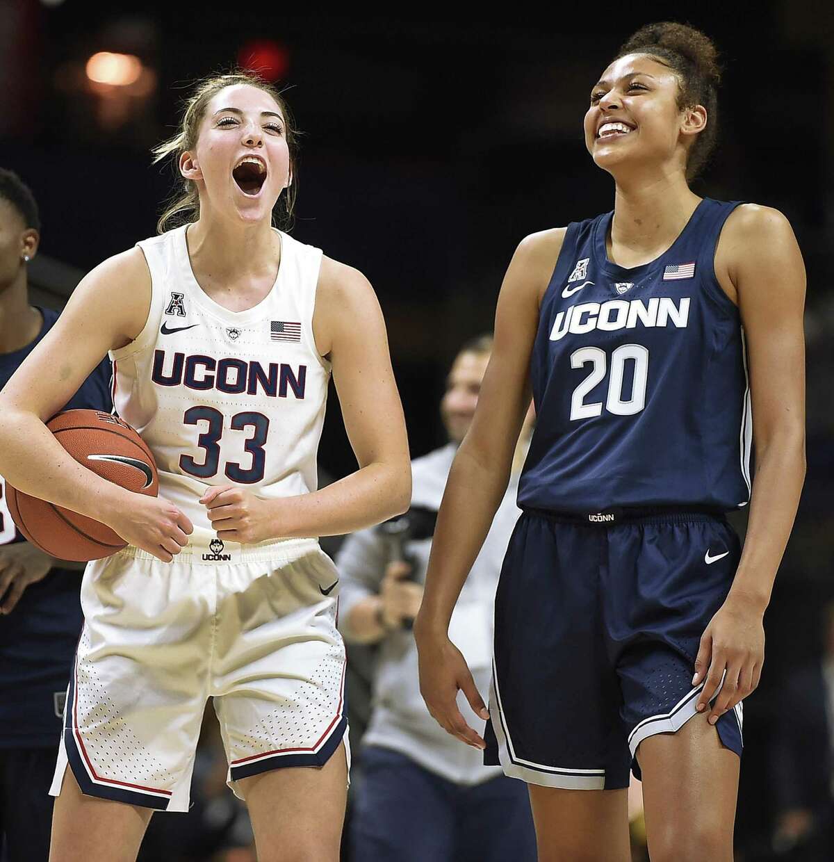 Katie Lou Samuelson cheers for teammate Olivia Nelson-Ododa, right, to win the slam dunk contest during the UConn’s men’s and women’s basketball teams’ annual First Night celebration in Storrs.