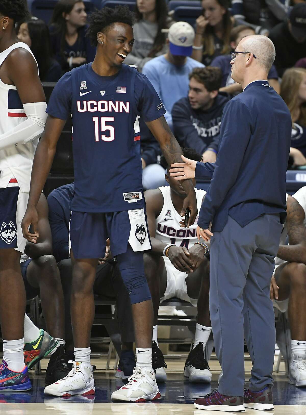 Connecticut's Sidney Wilson laughs as he talks with coach Dan Hurley during the UConn men's and women's basketball teams' annual First Night event in Storrs, Conn., Friday, Oct. 12, 2018. (AP Photo/Jessica Hill)