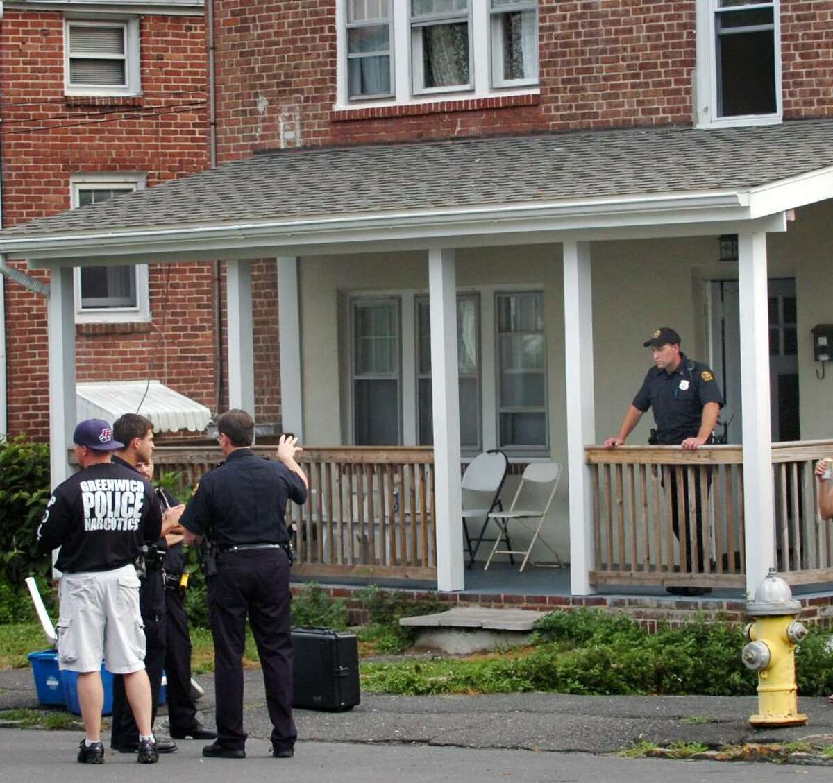 Greenwich police outside of 104 Pemberwick Road in the Pemberwick section of Greenwich, where two people were arrested for possession of marijuana, early Wednesday evening, July 14, 2010.