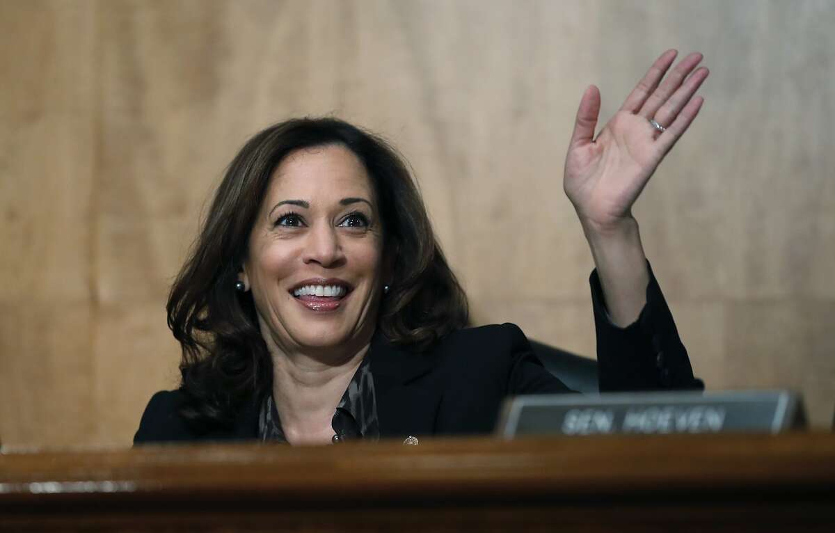 Sen. Kamala Harris, D-Calif., waves to another member of the committee during a hearing of the the Senate Committee on Homeland Security and Governmental Affairs for Steven D. Dillingham to be Director of the Census, on Capitol Hill, Wednesday, Oct. 3, 2018 in Washington. (AP Photo/Alex Brandon)