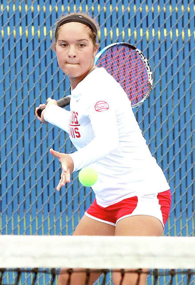 Alton’s Hannah Macias returns a shot during her third-place singles match Saturday at the Belleville East Class 2A Sectional in Belleville. Macias finished fourth to become the Redbirds’ first state qualifier since 2014. Photo: Greg Shashack | The Telegraph