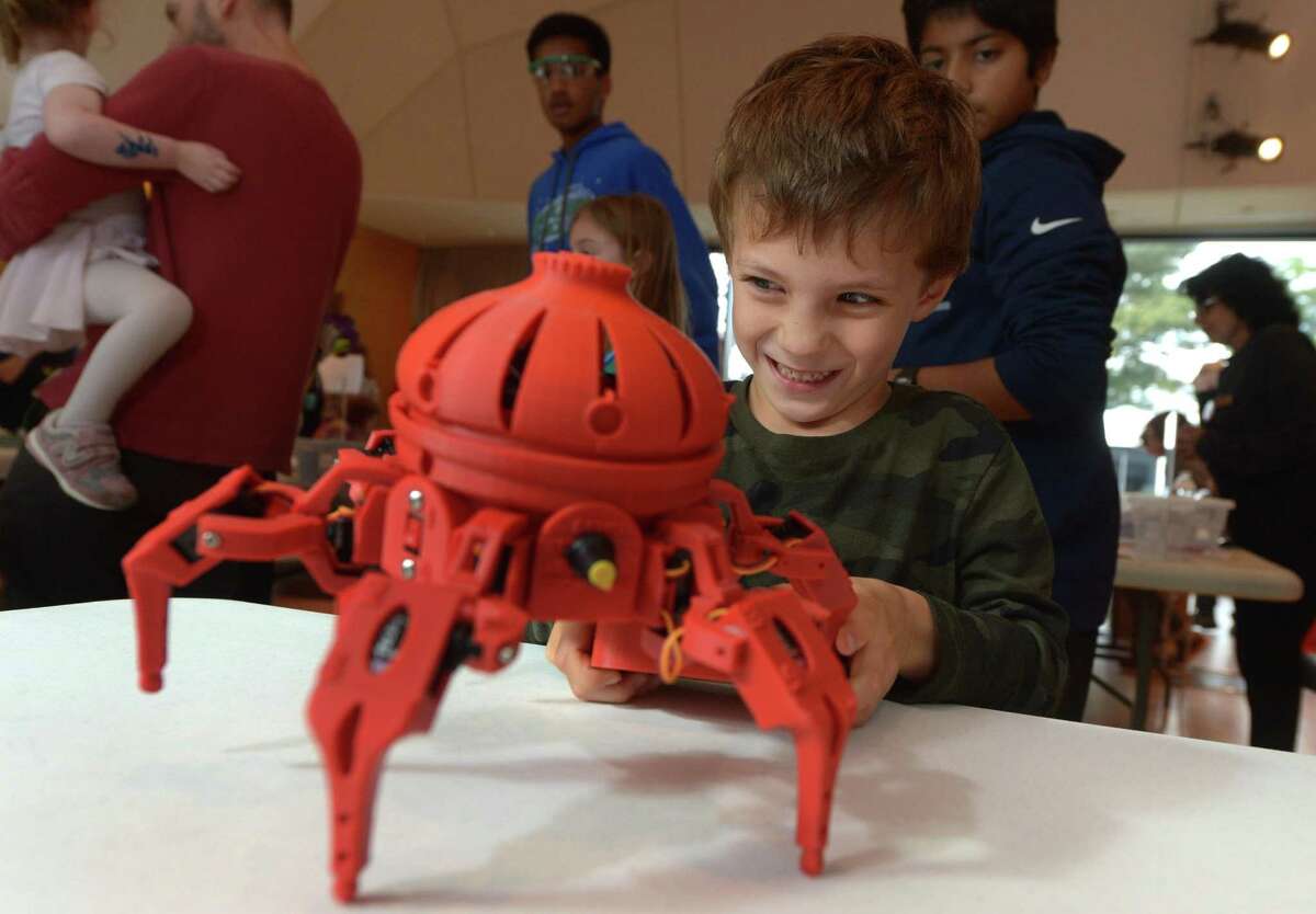 Wilton resident Hugh Cooper controls the robot, Vorpal, The Hexapod, during The Wilton Library?’s annual Innovation Day Saturday, October 13, 2018, at the library in Wilton, Conn. Innovation Day was a festival of making, creating and demonstrating. Visitors tested virtual reality, rode a hovercraft, experimented with LEDs watched 3D printing and learned craft making at the event.