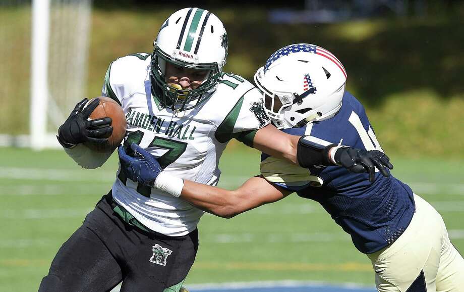 (17) stiff arms kings justin torres-west (4) as he rushes in