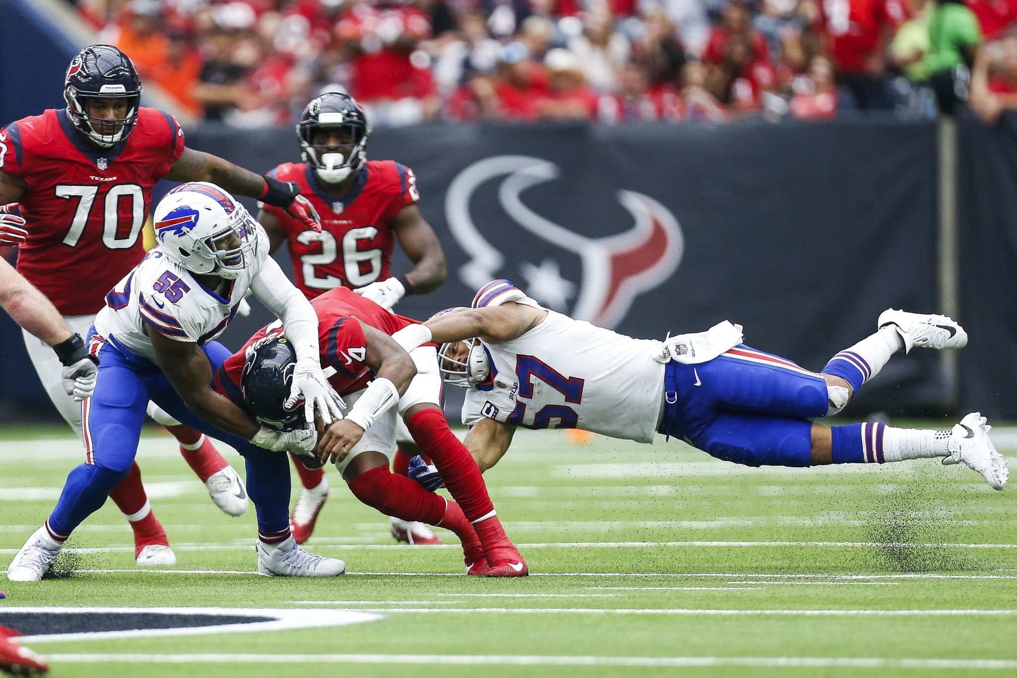 Houston, TX, USA. 14th Oct, 2018. Buffalo Bills running back Chris Ivory  (33) gets tackled as Houston Texans linebacker Jadeveon Clowney (90) pulls  him down by his hair during the 4th quarter