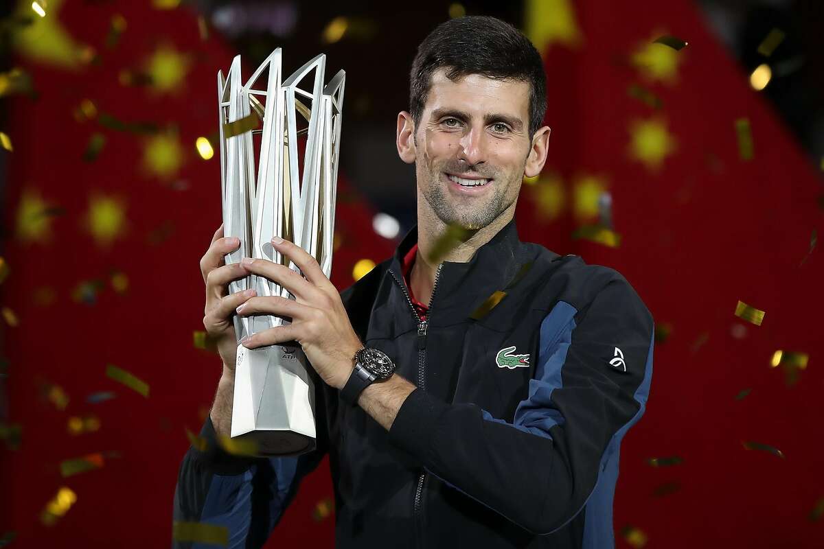SHANGHAI, CHINA - OCTOBER 14: Novak Djokovic of Serbia pose with trophy after winning his men's singles final match against Borna Coric of Croatia in the Men's singles final match on day 8 of Shanghai Rolex Masters at Qi Zhong Tennis Centre on October 14, 2018 in Shanghai, China. (Photo by Lintao Zhang/Getty Images) *** BESTPIX ***