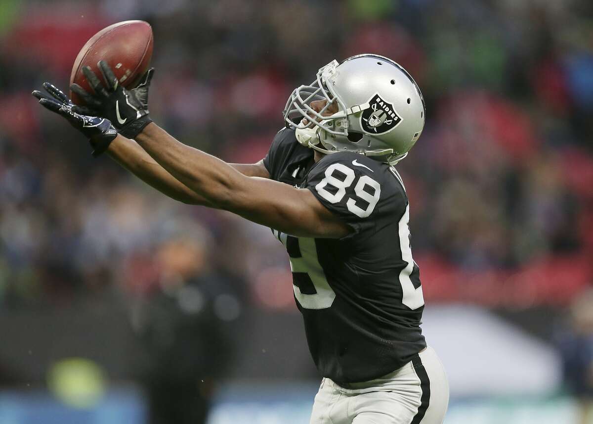 Oakland Raiders wide receiver Amari Cooper (89) catches the ball during the warm-up before an NFL football game against Seattle Seahawks at Wembley stadium in London, Sunday, Oct. 14, 2018. (AP Photo/Tim Ireland)