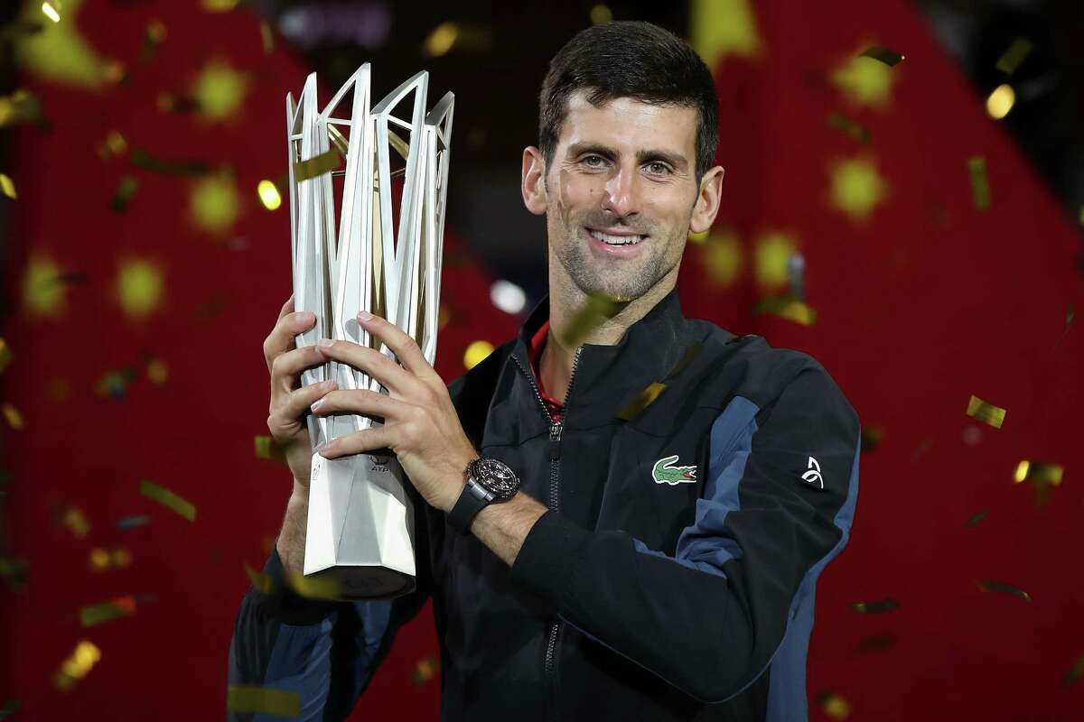 SHANGHAI, CHINA - OCTOBER 14: Novak Djokovic of Serbia pose with trophy after winning his men's singles final match against Borna Coric of Croatia in the Men's singles final match on day 8 of Shanghai Rolex Masters at Qi Zhong Tennis Centre on October 14, 2018 in Shanghai, China. (Photo by Lintao Zhang/Getty Images) *** BESTPIX ***