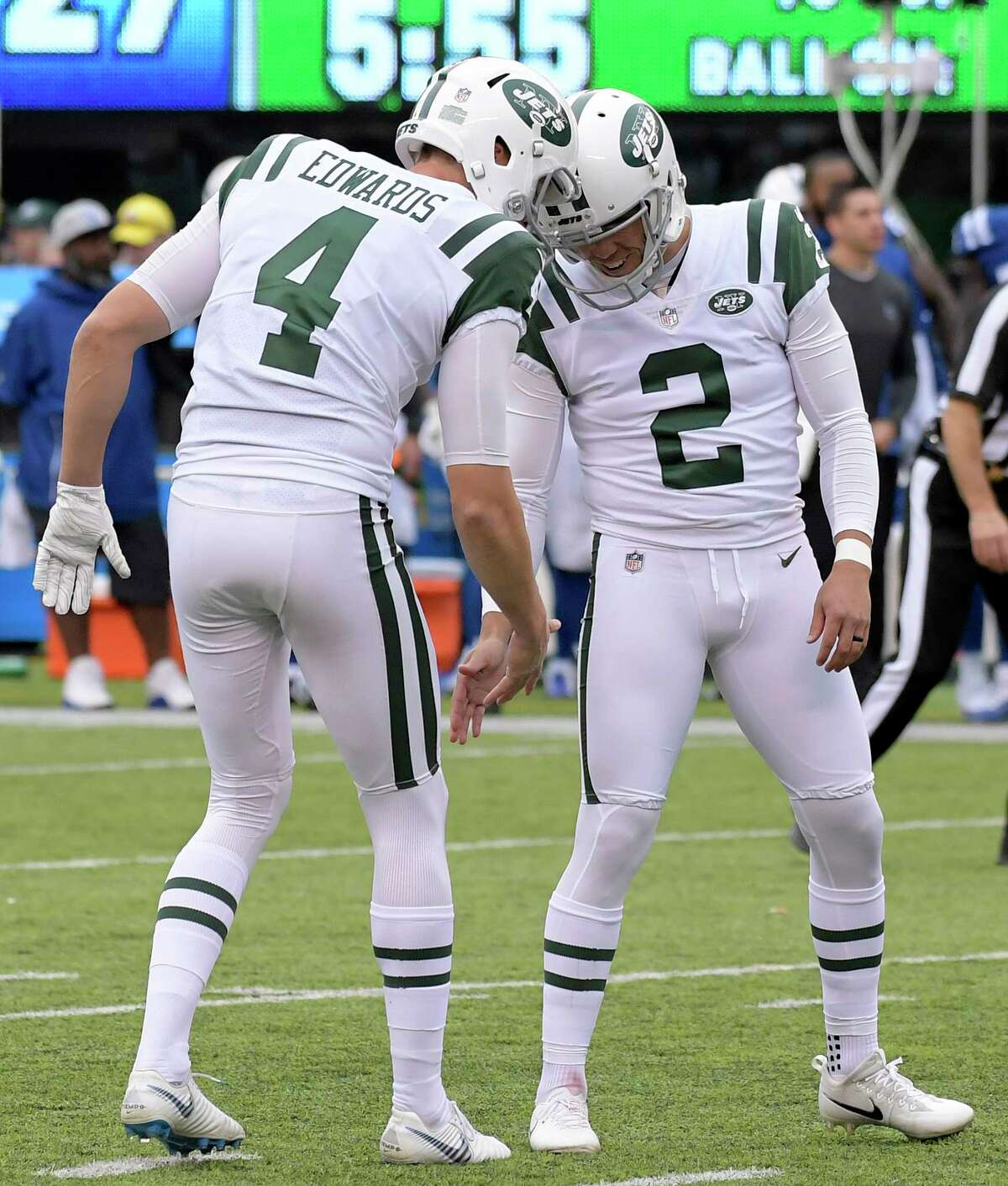 Indianapolis Colts quarterback Andrew Luck (12) scrambles as New York Jets  defensive end Leonard Williams (92) chases him during the first half of an  NFL football game, Sunday, Oct. 14, 2018, in