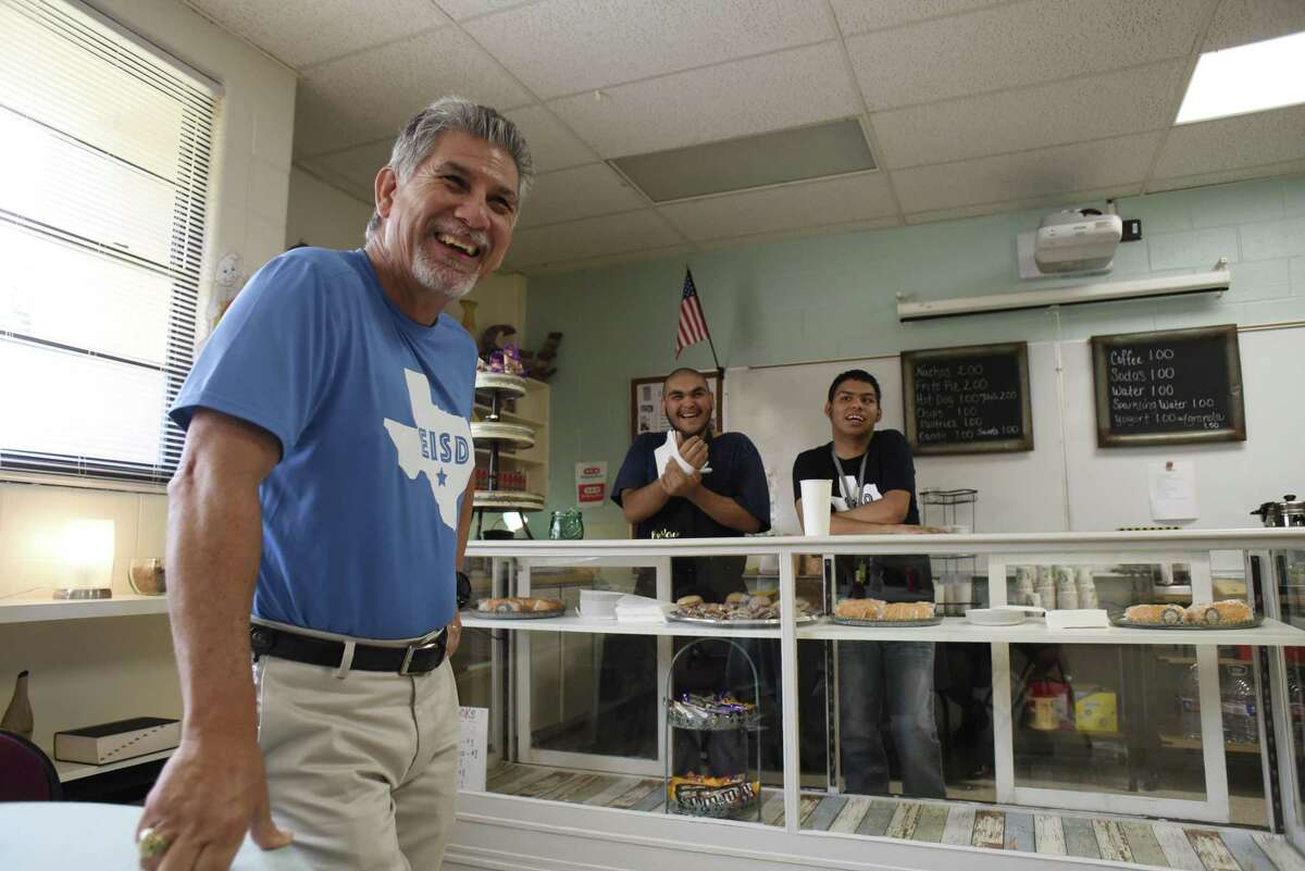 Special education teacher Ric Castillo shares a laugh with students Celestino Cervantes, middle, and Justin Avila at the student-run cafe at the Burleson Center for Education and Innovation on Sept. 28, 2018.