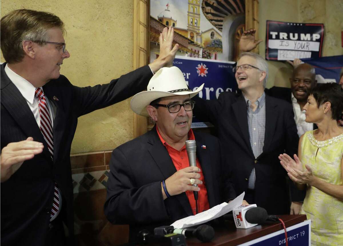 CORRECTS DATE Republican Pete Flores, second from left, talks to supporters as Texas Lt. Gov. Dan Patrick, left, and Republican State Chairman James Dickey, second from right, high-five after Flores defeated Democrat Pete Gallego in a runoff election, capturing a reliably blue state Senate seat, Tuesday, Sept. 18, 2018, in San Antonio. Flores will replace Sen. Carlos Uresti, who stepped down in June after being sentenced to 12 years in prison on federal fraud charges. State Sen. Donna Campbell is at right. (AP Photo/Eric Gay)