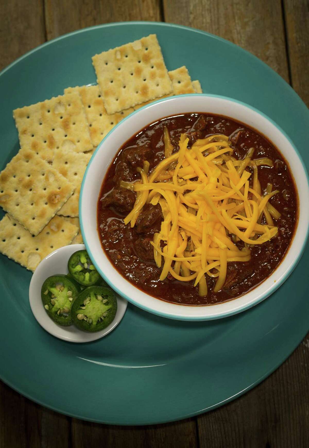Seven-Chile Texas Chili from "The Homesick Texan Cookbook" by Lisa Fain is made using chuck roast simmered in a dried chile paste and plenty of spices including cinnamon, clove and allspice as well as brewed coffee and beer.