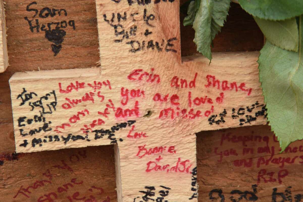 A message to crash victims Erin and Shane are seen on a wooden cross as the memorial for the Schoharie limo crash victims grows at the site of the accident next to the Apple Barrel Store on Monday, Oct. 15, 2018 in Schoharie, N.Y. (Lori Van Buren/Times Union)