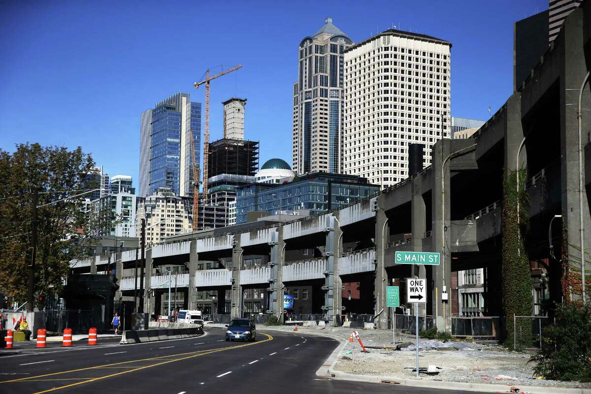 Construction continues on Alaskan Way and the viaduct, Monday, Oct. 15, 2018. Alaskan Way has been moved out from under the viaduct and almost all traffic has been redirected to the new, wider road west of the viaduct. The viaduct is slated to close permanently Jan. 11.