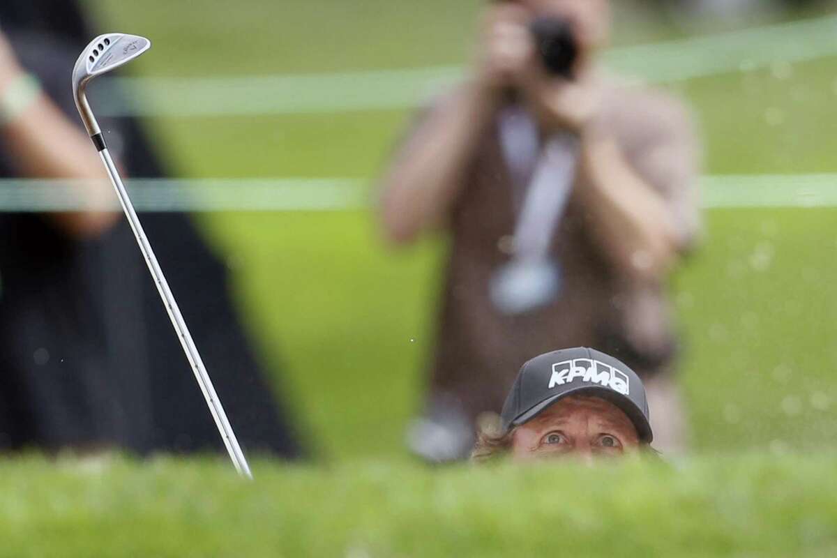 Phil Mickelson watches his bunker shot go in the hole for a birdie on the 2nd hole during Safeway Open Pro-Am at Silverado Resort and Spa in Napa on Tuesday, October 2, 2018.