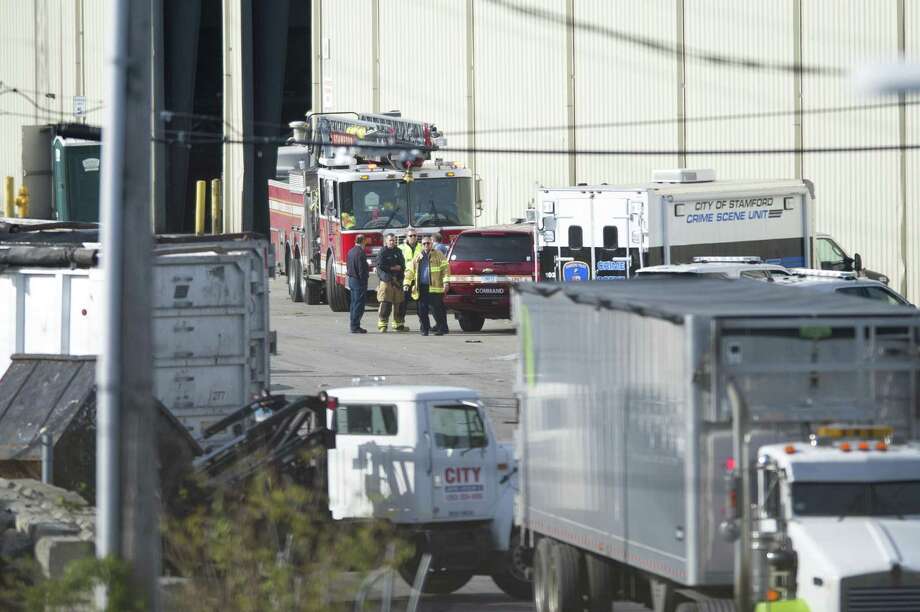 Emergency personnel respond to a report of a dead baby found in a dumpster in Stamford on Tuesday. Photo: Michael Cummo / Hearst Connecticut Media / Stamford Advocate
