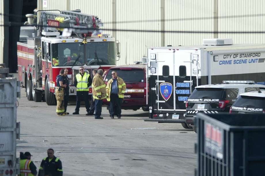 Emergency personnel respond to a report of a dead baby at City Carting & Recycling in Stamford on Tuesday. Photo: Michael Cummo / Hearst Connecticut Media / Stamford Advocate