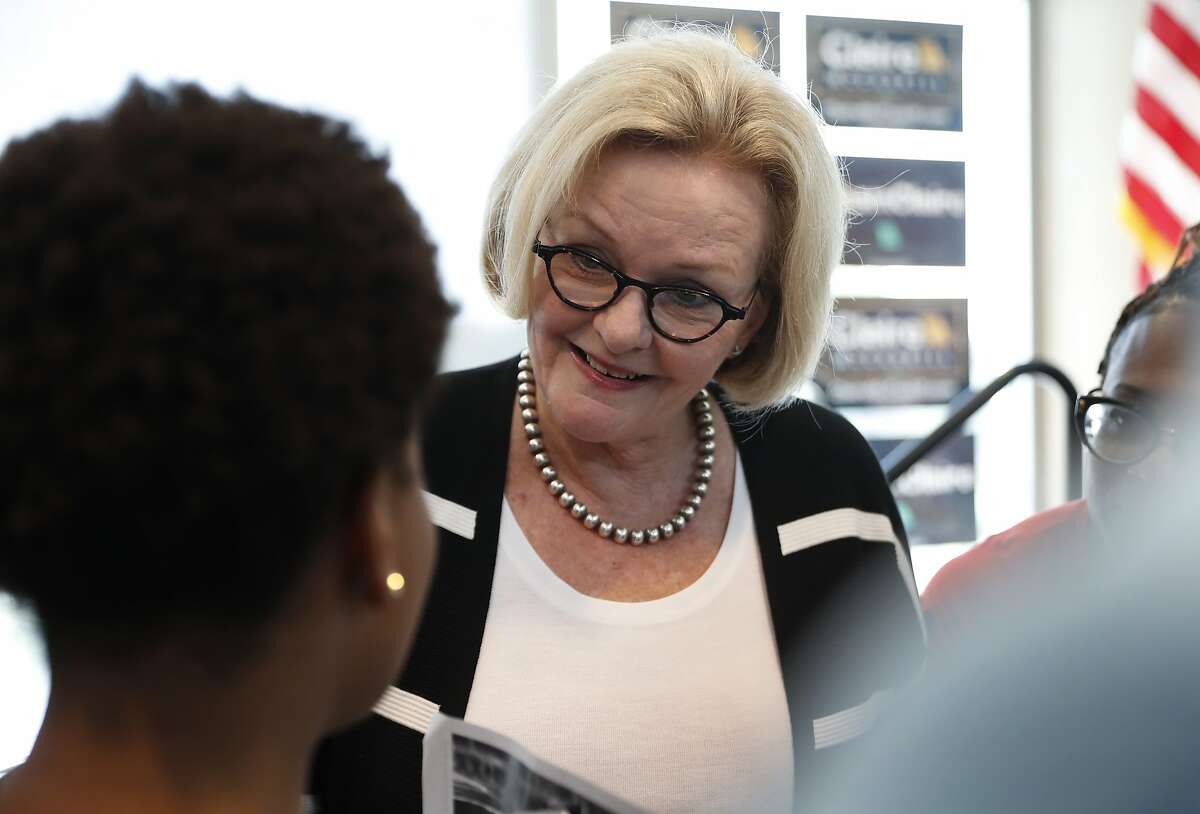 FILE - In this Tuesday, Sept. 11, 2018, file photo, Sen. Claire McCaskill, D-Mo., speaks to a supporter at a campaign stop at the University of Missouri - St. Louis, in St. Louis. Democrats are leading Republicans in the money race in many of the key Senate and House campaigns three weeks from the midterm elections that will determine who controls Capitol Hill in January. McCaskill reported $7 million in net contributions that includes $4.6 million in itemized individual contributions and another $2.18 million from non-itemized, small-dollar contributors. (AP Photo/Jeff Roberson, File)