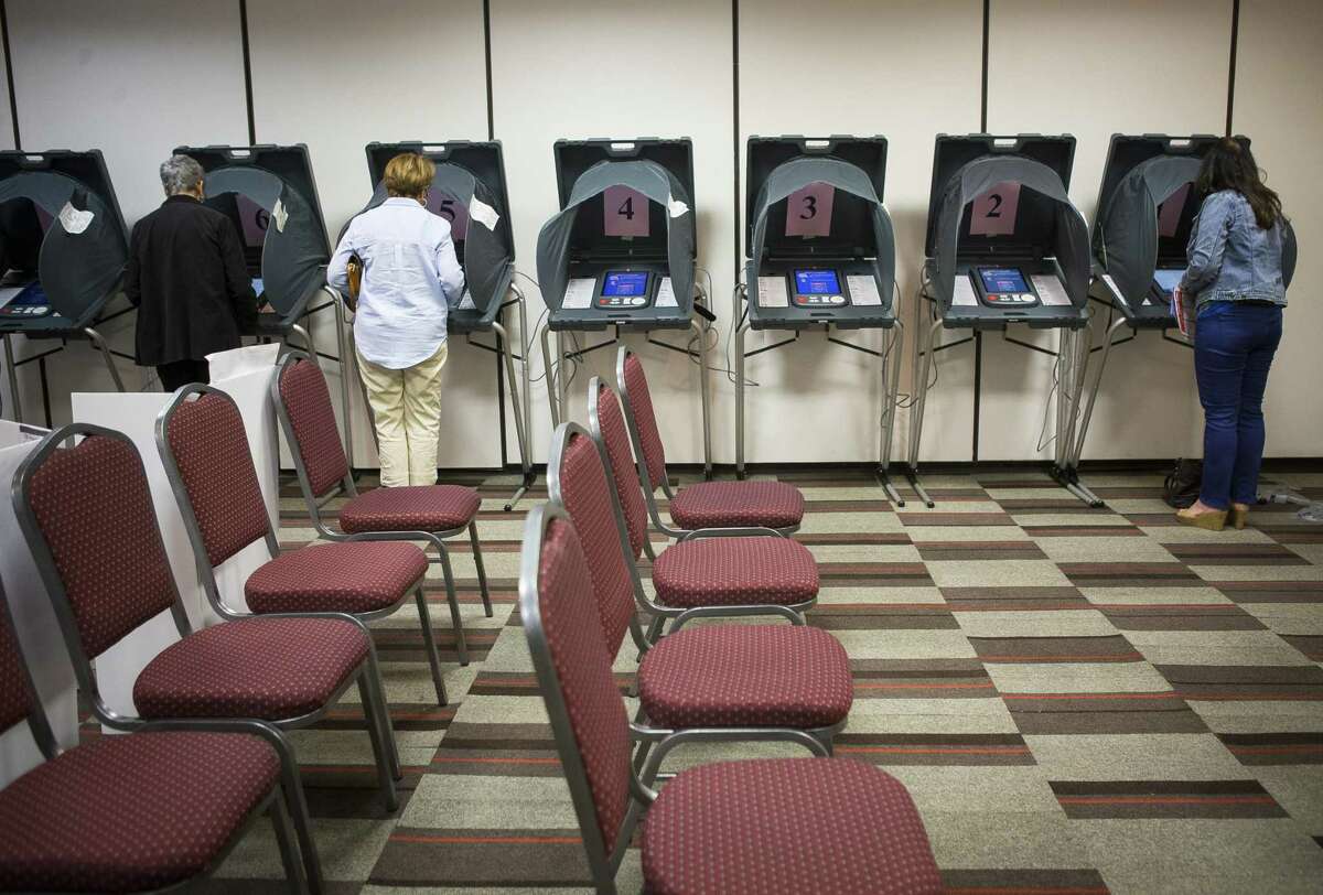 Voters use voting machines inside the Republican primary polling location at the Four Points by Sheraton on the Southwest Frwy at Wakeforest Drive, Tuesday, March 6, 2018, in Houston.