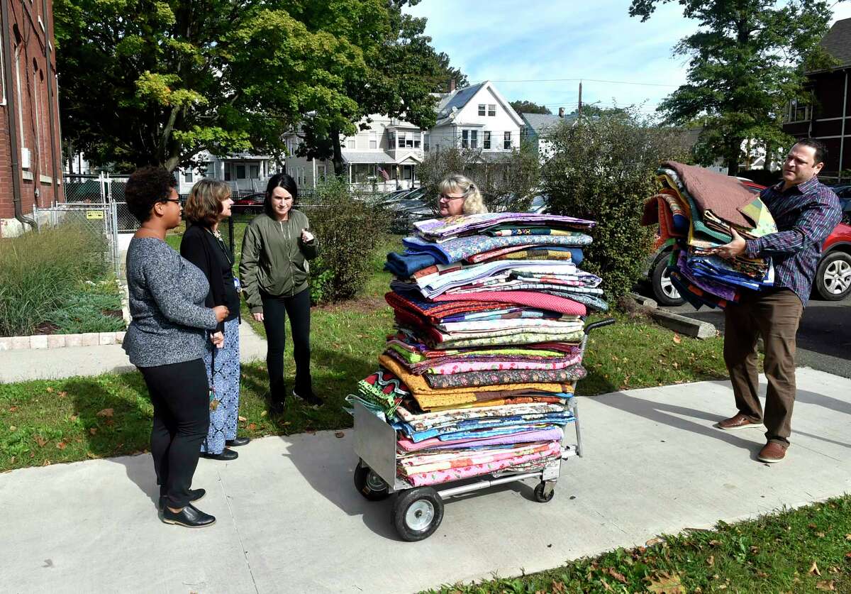 File photo of New Reach receiving donated quilts through the "Keeping Homeless Kids Warm" project. New Reach - Life Haven Shelter offers safe emergency housing for homeless pregnant women and disenfranchised women with young children.