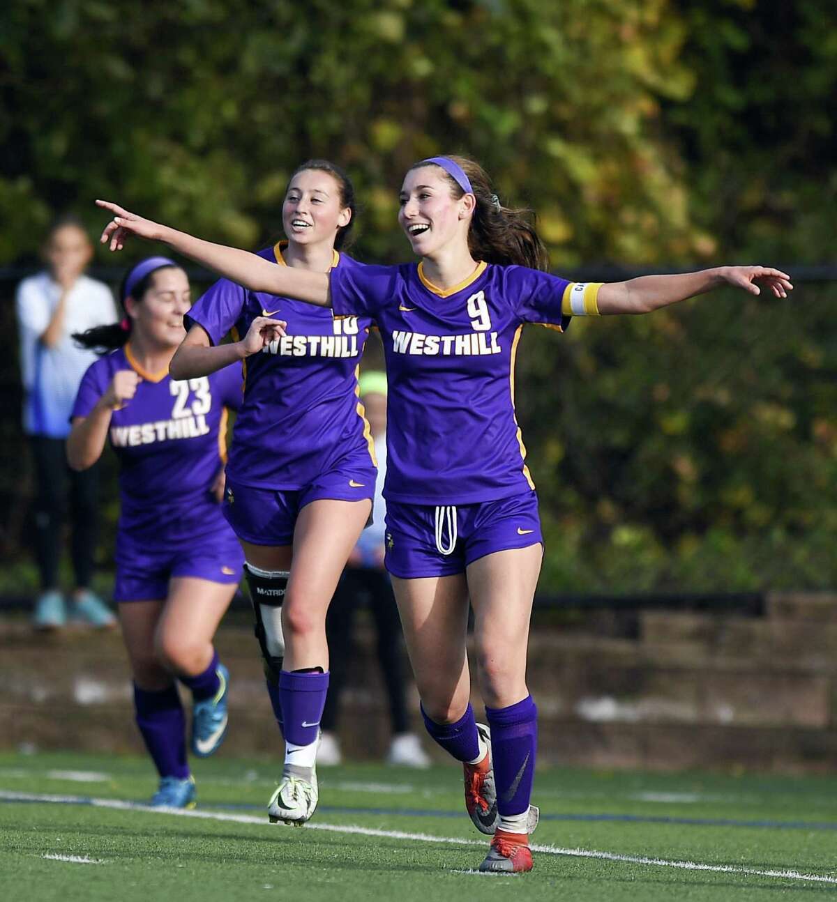 Westhill’s Corinne Dente (9) celebrates her goal against Darien in the first half of a FCIAC girls soccer game in Stamford on Tuesday. Dente scored twice in a 2-1 win.