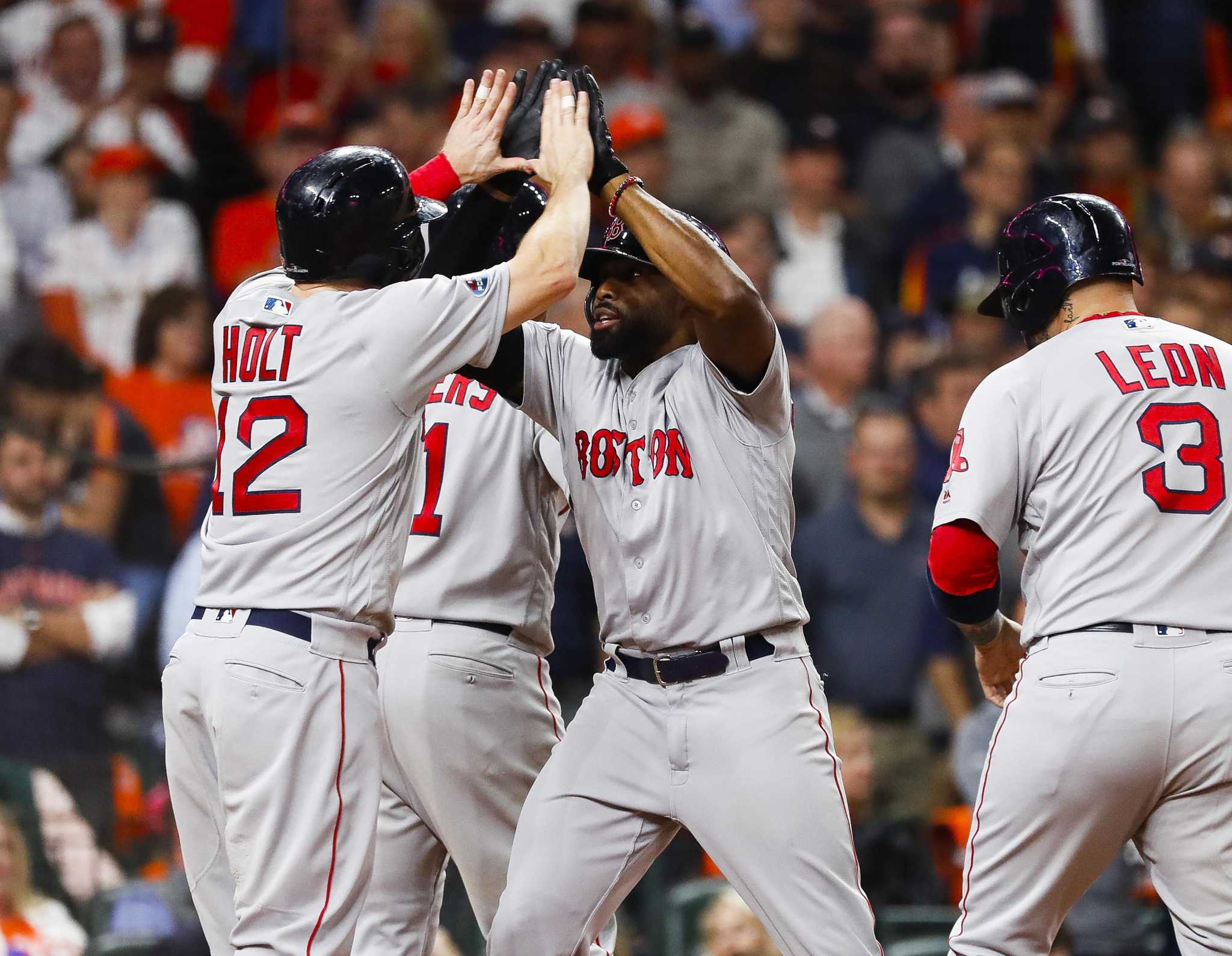 Brock Holt of the Boston Red Sox reacts after hitting an RBI