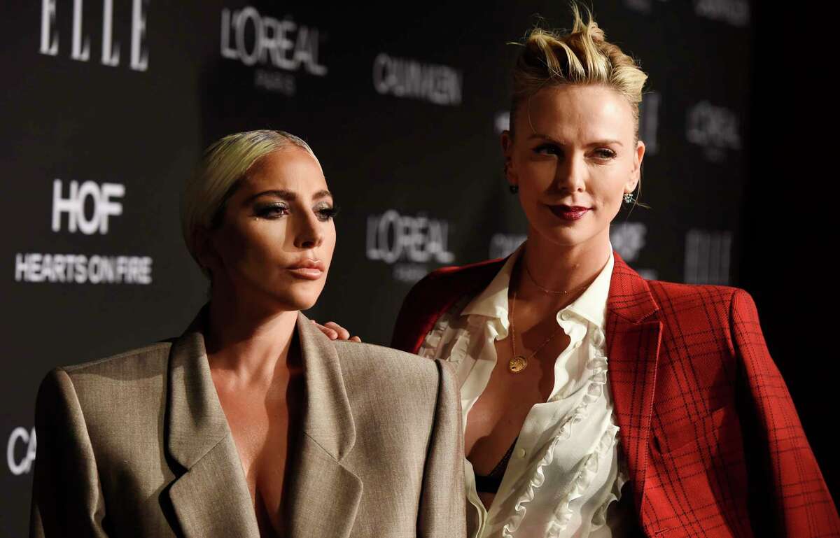 Honorees Lady Gaga, left, and Charlize Theron pose together at the 25th Annual ELLE Women in Hollywood Celebration, Monday, Oct. 15, 2018, in Los Angeles. (Photo by Chris Pizzello/Invision/AP)