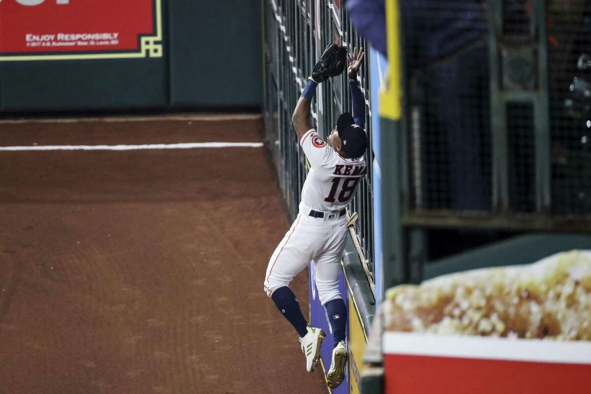 Houston Astros left fielder Tony Kemp (18) catches a high fly ball off the wall to end the top of the third inning of Game 3 of the American League Championship Series at Minute Maid Park Tuesday Oct. 16, 2018 in Houston.