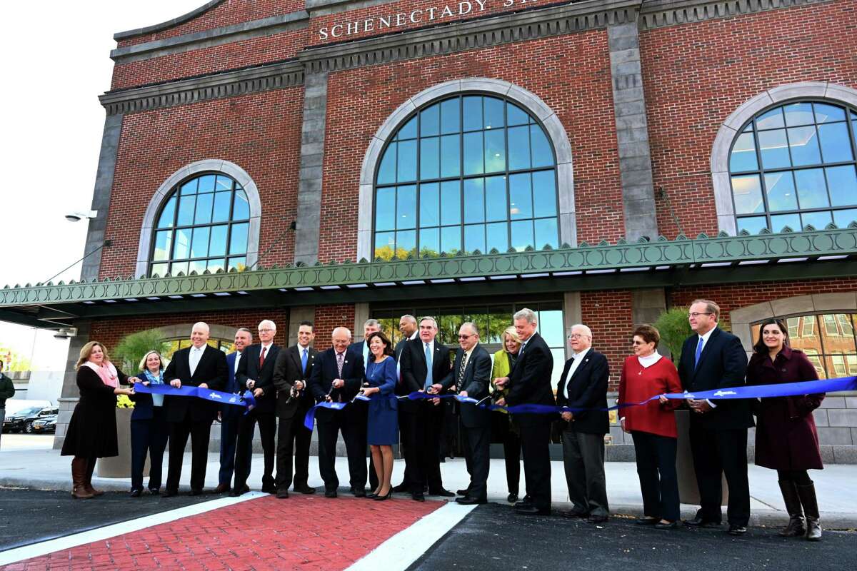 Lt. Governor Kathy Hochul, center, cuts the ceremonial ribbon with state, federal and local officials at the opening of the new Schenectady train station officially opened Wednesday Oct.17, 2018 in Schenectady, N.Y. (Skip Dickstein/Times Union)