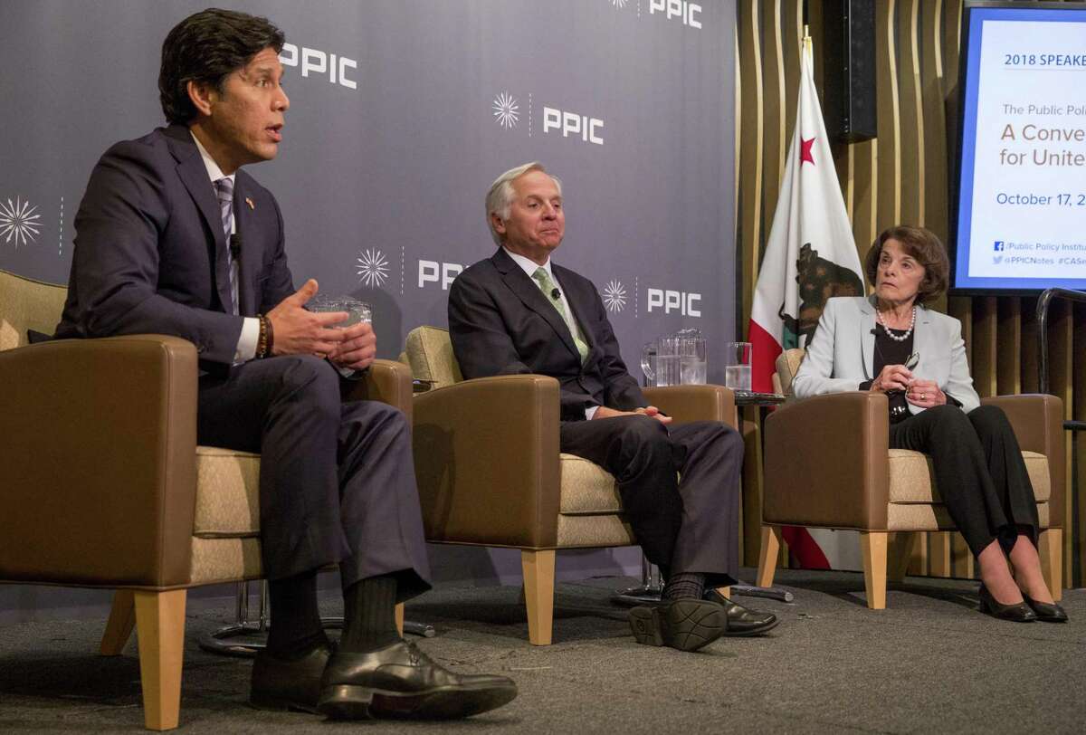California State Senator Kevin De Leon, left, and U.S. Senator Dianne Feinstein, right, face off during a United States Senate debate moderated by Public Policy Institute of California CEO and President Mark Baldassare, center, held at the Public Policy Institute of California in San Francisco, Calif. Wednesday, Oct. 17, 2018.