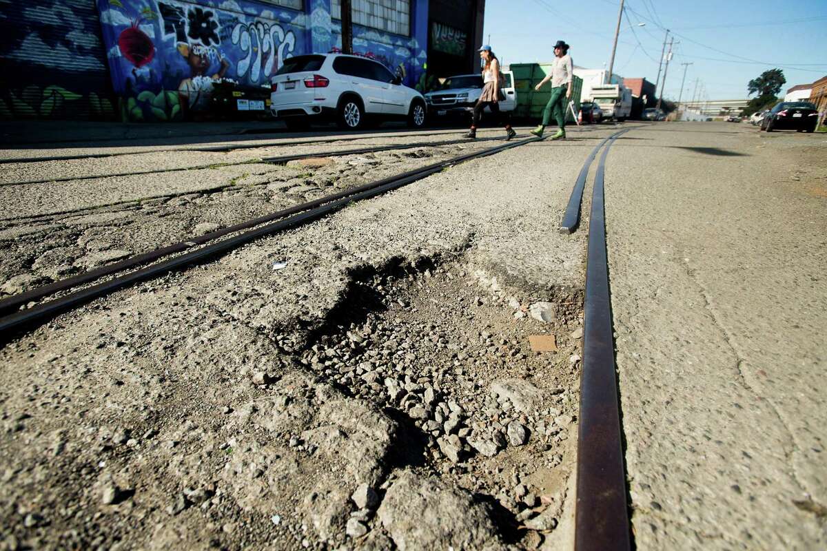 A pothole in Oakland. Click through the gallery to read about the amount of money drivers in various cities spend on maintenance because of bad roads, plus a look at the worst roads overall.