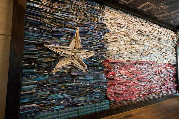 The George Hotel Dedicates Texas Flag Book Wall To Barbara Bush