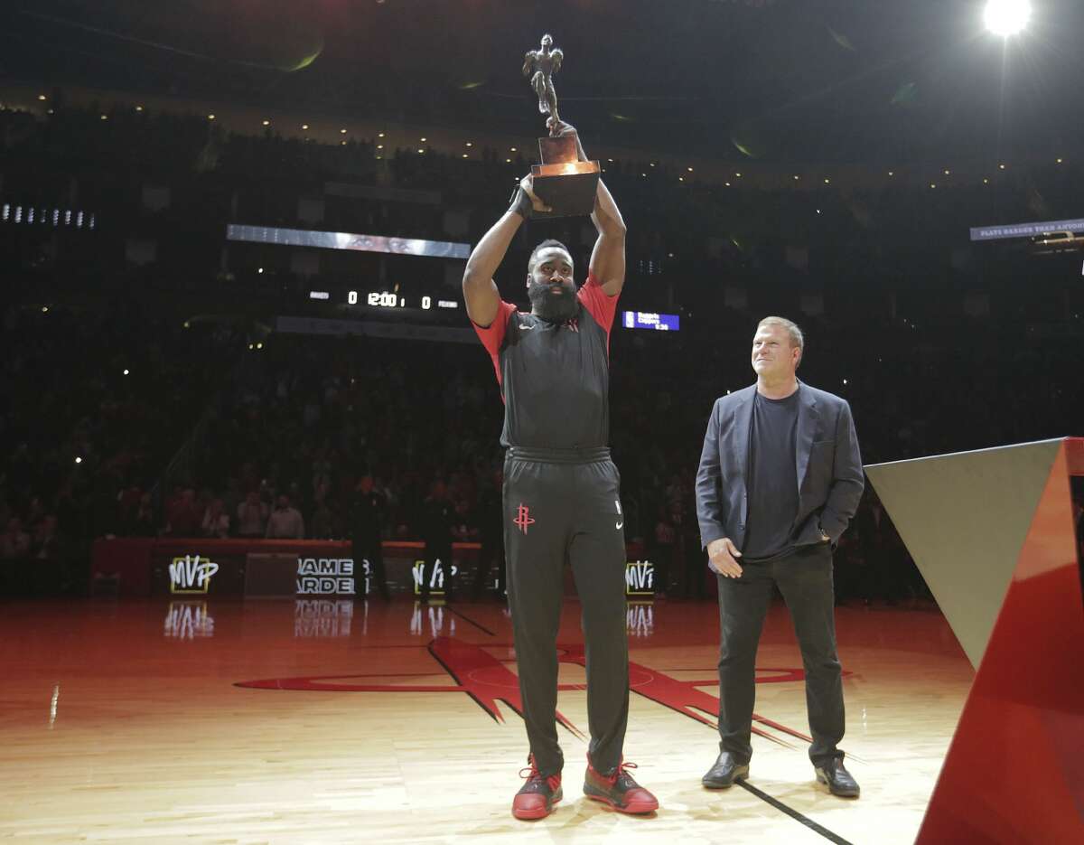 James Harden, accepting the trophy from owner Tilman Fertitta on opening night, became the third Rockets player to win NBA MVP honors.