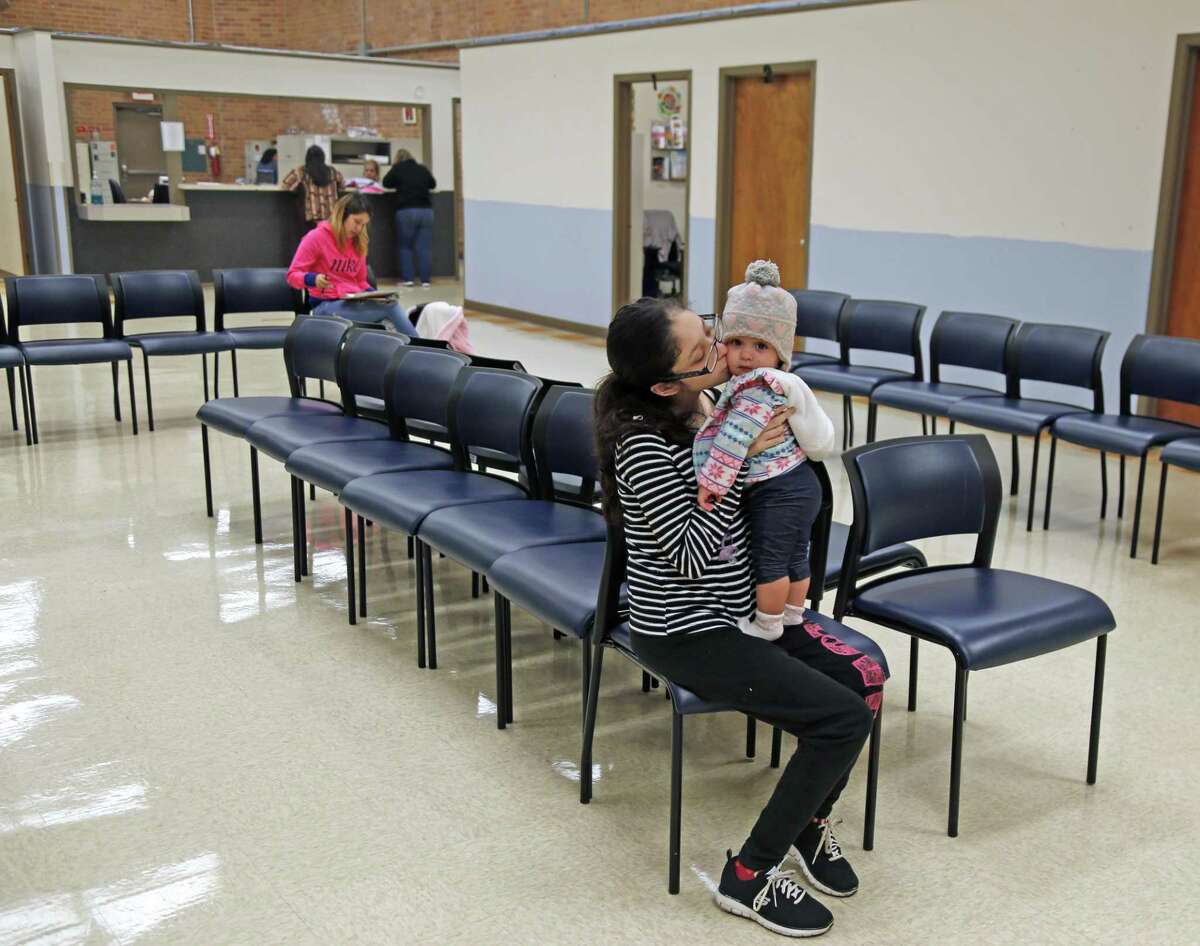 Maria Esclante with her child Hazel Beck,11 months, waits to be seen at the WIC clinic on Buena Vista on Oct. 16, 2018.
