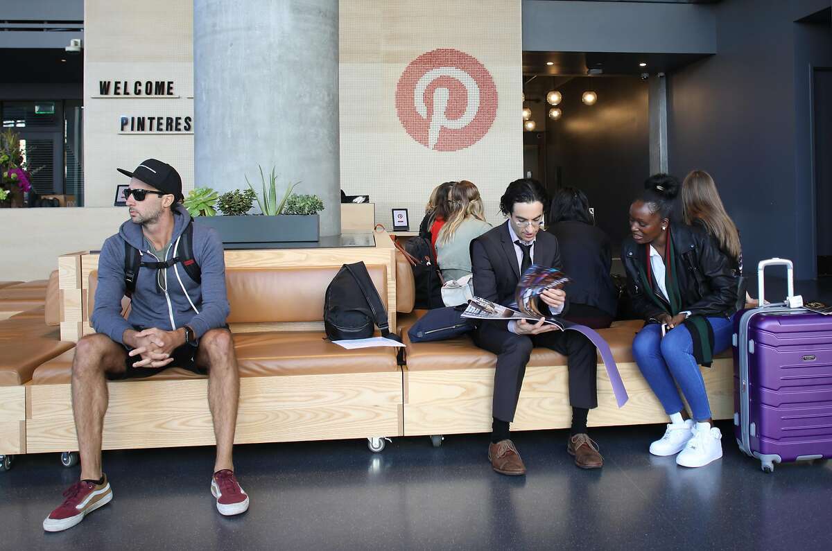 View of the public lobby and reception desk (behind) at Pinterest on Tuesday, Oct. 9, 2018 in San Francisco, Calif.