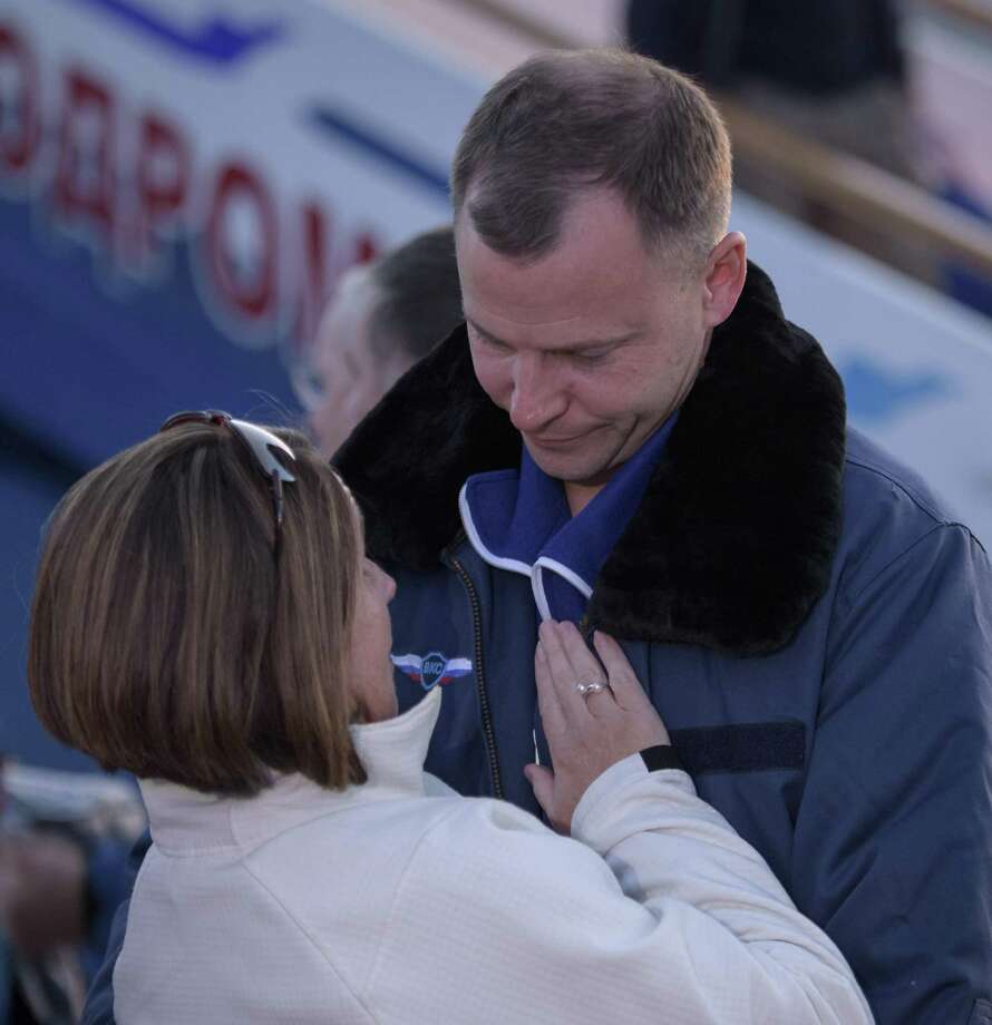 In this handout provided by NASA, American astronaut Nick Hague of NASA embraces his wife after landing at the Krayniy Airport after an aborted launch of the Russian Soyuz spacecraft headed to the International Space Station. The crew was quickly recovered in good condition. Photo: Bill Ingalls / NASA, Handout / NASA Via Getty Images / 2018 Bill Ingalls / NASA