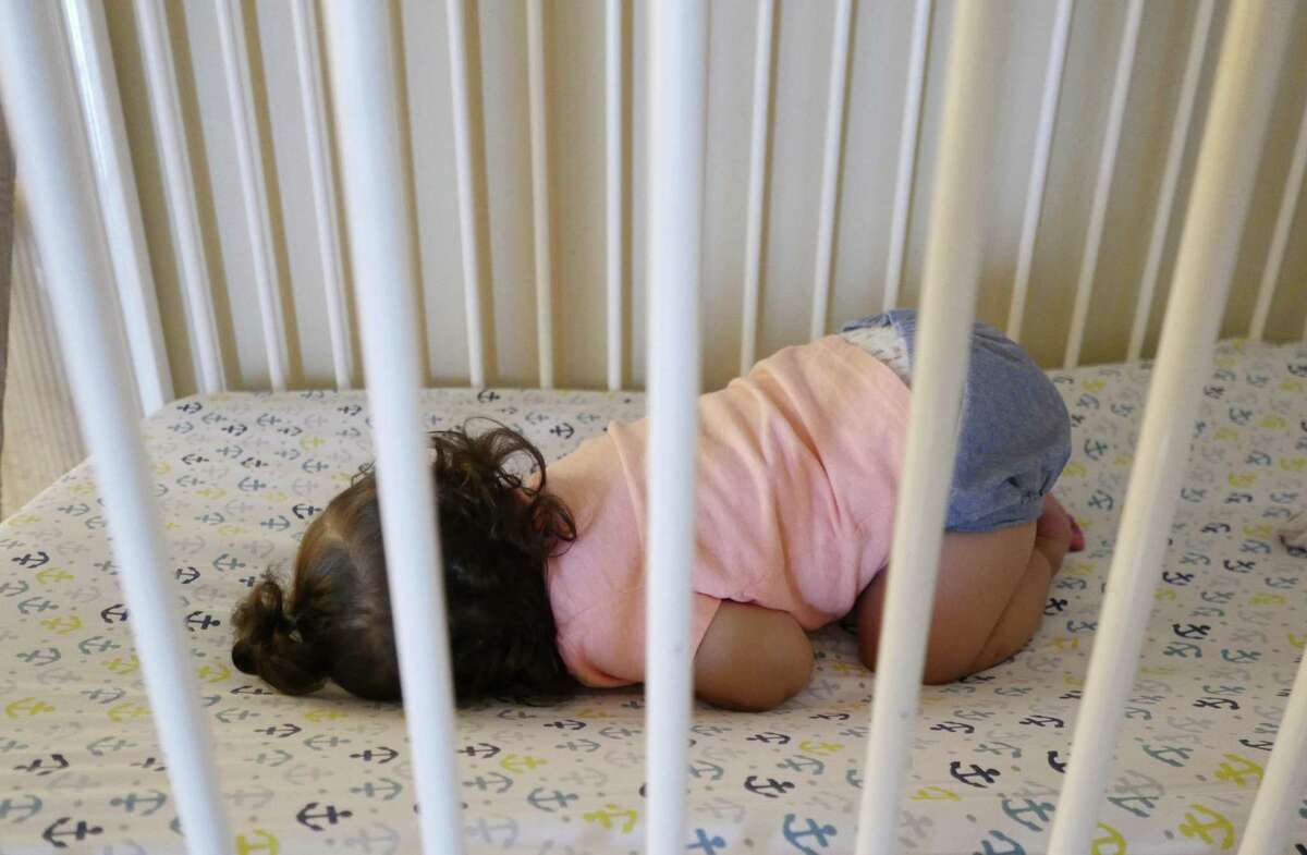 A child sleep at the Children's Shelter of San Antonio on Tuesday, Aug. 21, 2018.