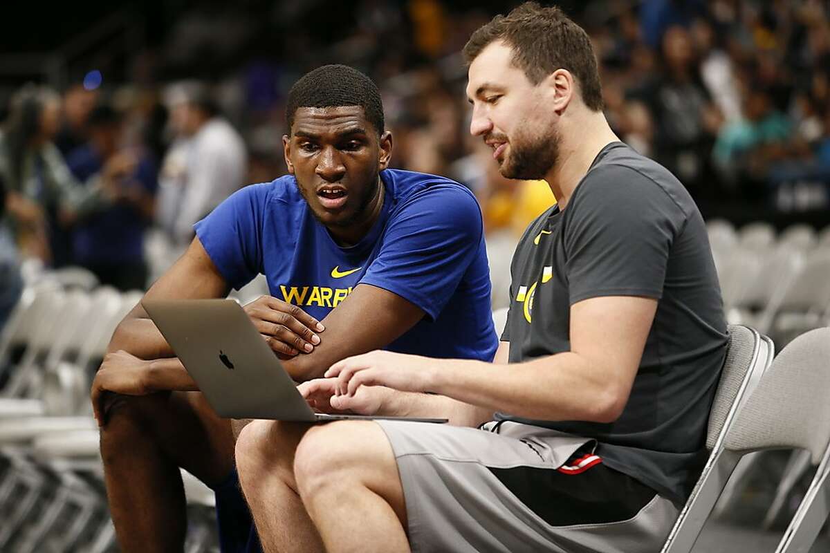 From left: Golden State Warriors forward Kevon Looney (5) with assistant coach Chris DeMarco before an NBA preseason game against the Los Angeles Lakers at SAP Center on Friday, Oct. 12, 2018, in San Jose, Calif.