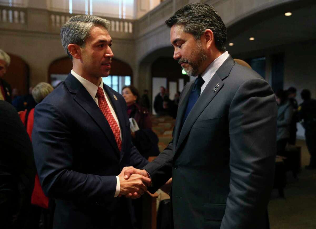 San Antonio Mayor Ron Nirenberg congratulates City Council member Roberto Treviño on the council’s passage of a the Alamo Plan in 2018. The two are now on opposite sides of a debate over where to put bike lanes on the Broadway Corridor project.
