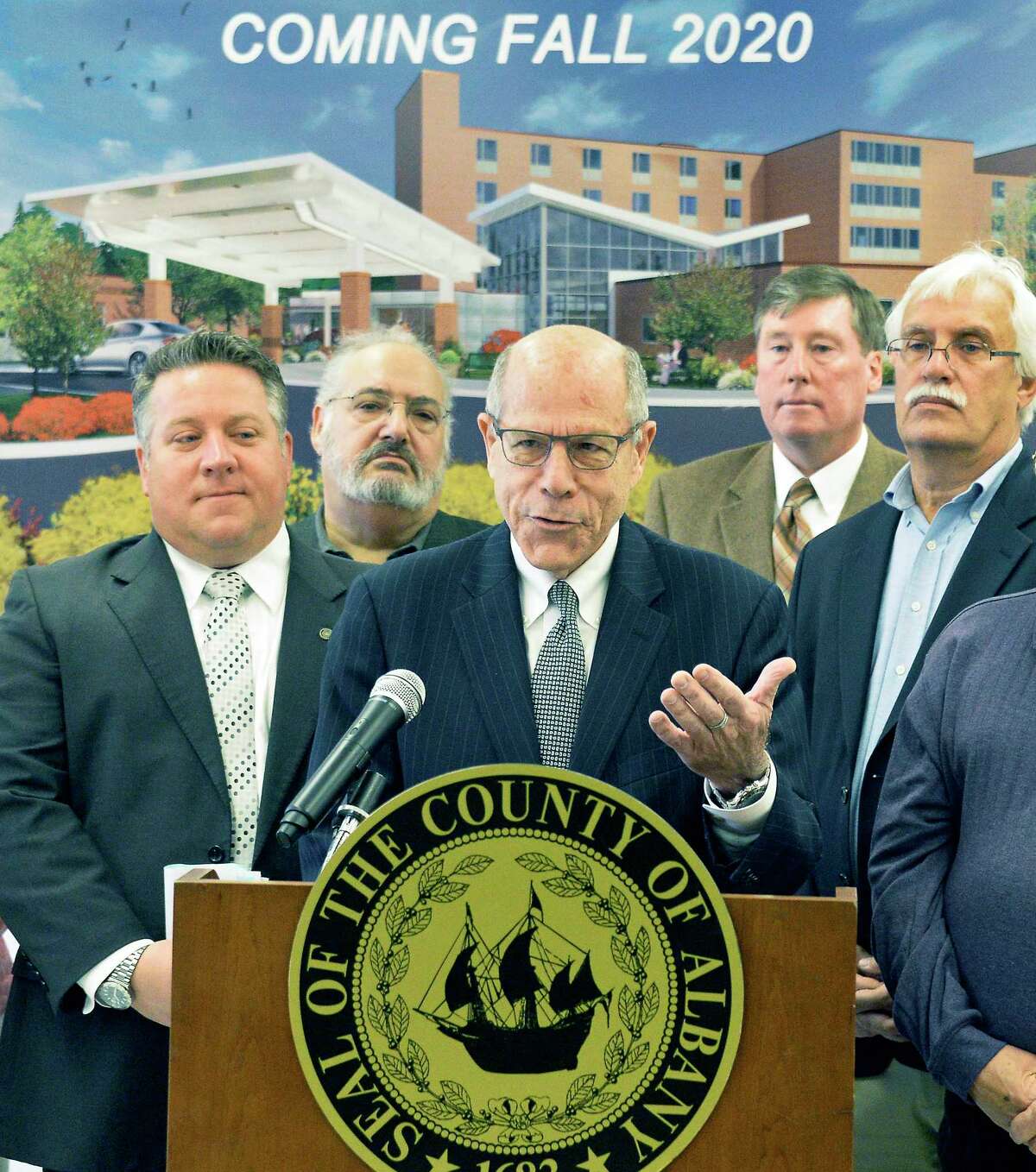 Executive director Larry Slatky, center, speaks during a news conference on the renovations of the Albany County Nursing Home Thursday Oct. 18, 2018 in Colonie, NY. At left is Albany County Executive Dan McCoy. (John Carl D'Annibale/Times Union)