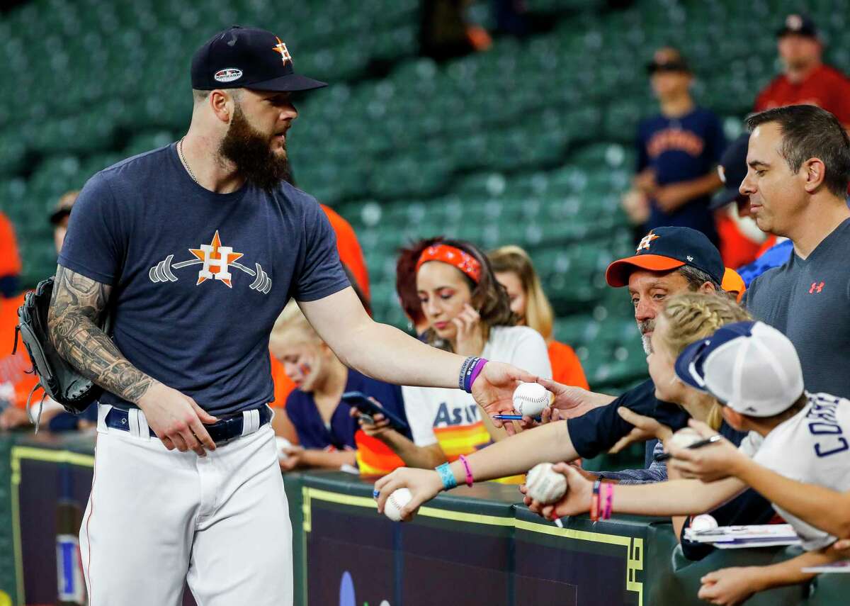 Houston Astros pitcher Dallas Keuchel (60) signs autographs before Game 5 of the American League Championship Series at Minute Maid Park on Thursday, Oct. 18, 2018, in Houston.